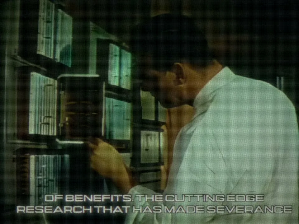Technician searching a wall of files